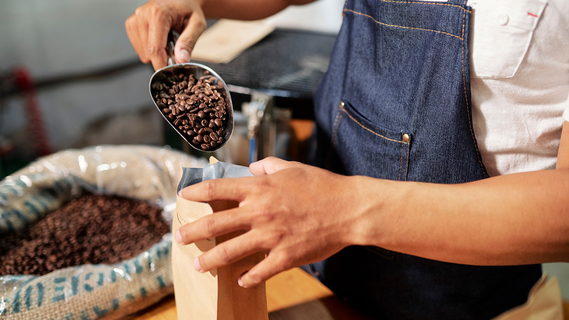 Coffee beans being weighed and put into a bag